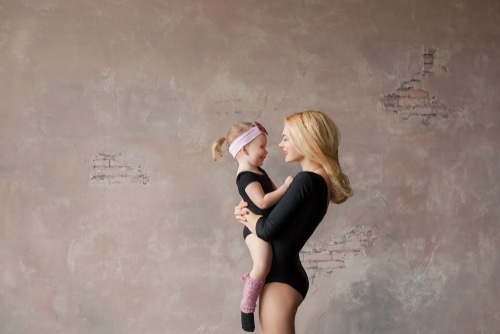ballerina mom and daughter in the Studio in black gymnastic swimwear