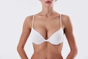 Woman in a bra after breast augmentation with lift in Savannah, GA.