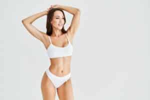 Woman in white underwear and bra after breast lift in Savannah, GA